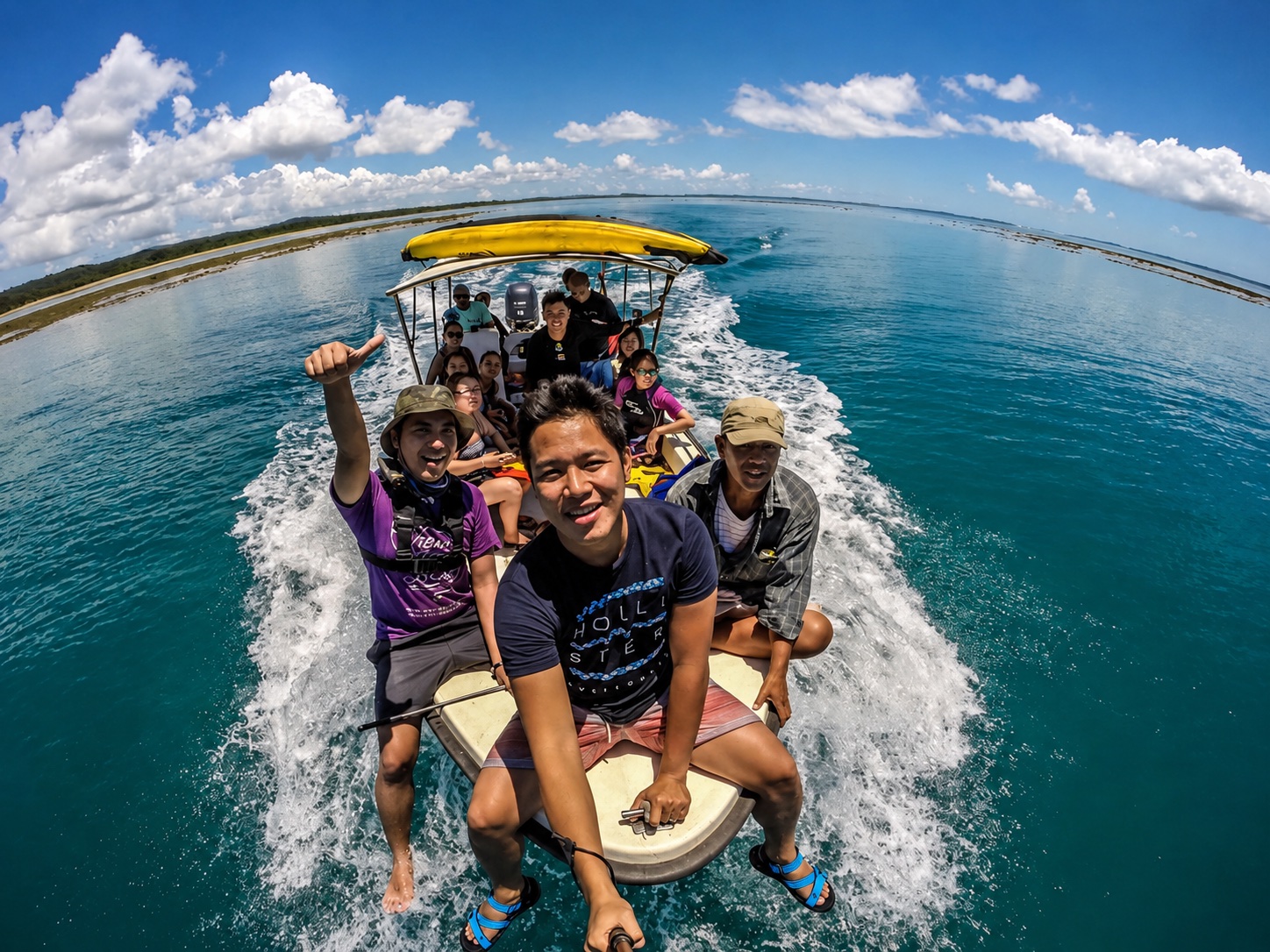 GoPro selfie on a banca speeding across turquoise water